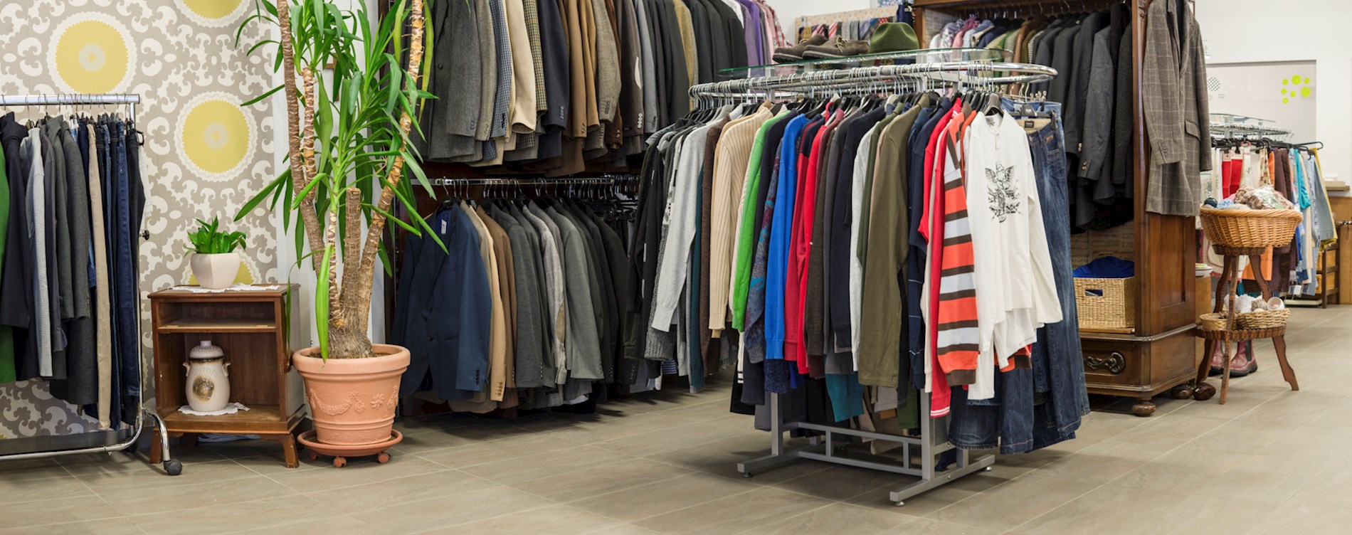 You can see several racks of trendy clothes in a Carla shop.