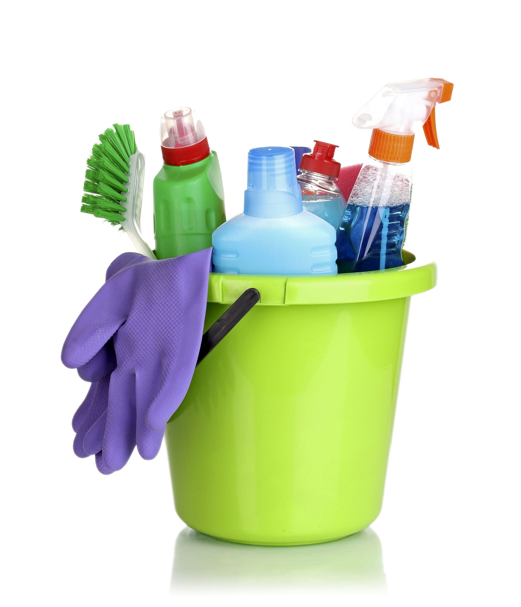 There is a light green plastic bucket. In it, there are different cleaning products, a brush and purple rubber gloves.